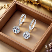 <tc>1ct ronde Moissanite oorbellen in 925 zilver</tc>